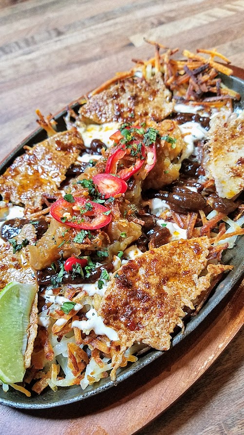 Expatriate Brunch, all hash brown platters will pale in flavor after you enjoy the Smothered and Covered Expatriate Hash Browns with pho sour cream, sharp cheddar, thai chili & sauteed onion, salsa, basil, thinly sliced eye of round, hoisin-tamarind sauce, and fried shallots.