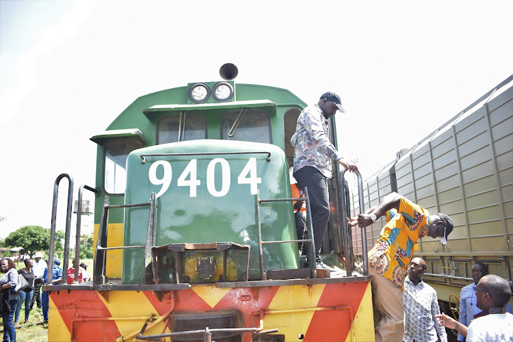 Roads and Transport CS Kipchumba Murkomen and Uganda's State Minister for Works and Transport Musa Ecweru disembark from a cargo train in Malaba on May 27, 2023.