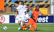 Jabulani Maluleke of Polokwane City (R) is challenged by Daylon Claasen of Bidvest Wits (L) during the Absa Premiership match at Bidvest Stadium in Johannesburg on April 22, 2018. 
