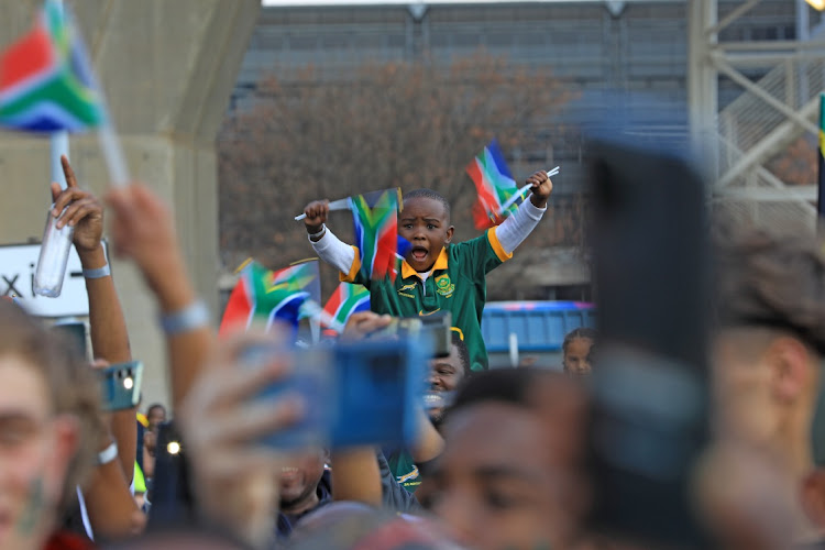 Khumo Mdingi cheers for the SA Rugby team as they depart from OR Tambo international airport for France to defend their World Cup title. Fans came in numbers to wish the team well in their campaign.