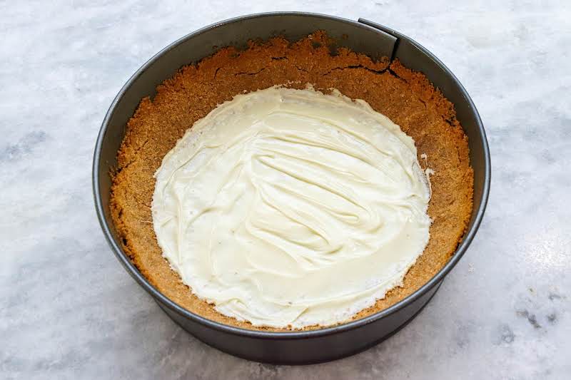 Melted White Chocolate Spread On The Bottom Of The Baked Crust.