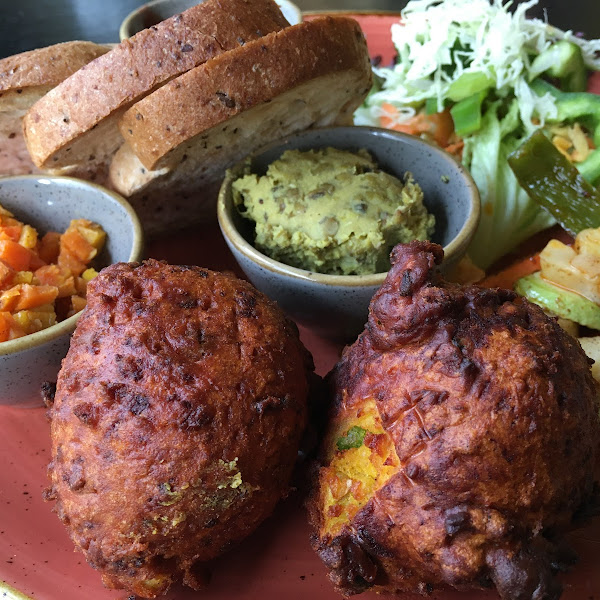 Indian: Bondas, Omnik Houria, Tamarind-Plum-Chutney, Mungbean spread, marinated veggies, gluten free bread.