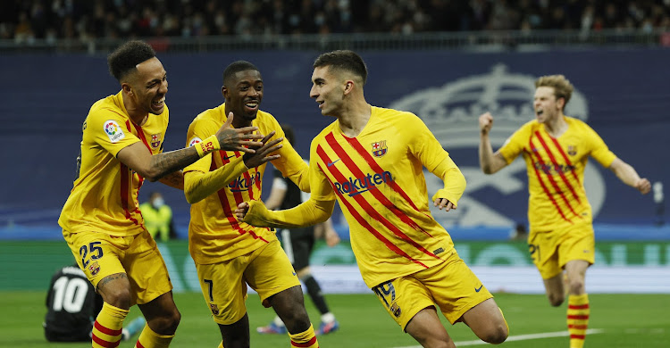 Barcelona's Ferran Torres celebrates scoring their third goal with teammates.