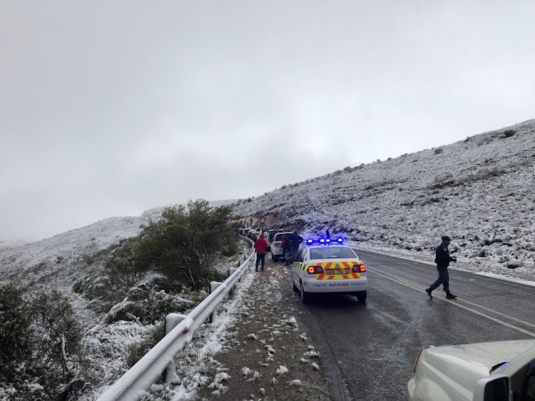 Traffic officers are on site to ensure motorists are safe on the snowy roads.