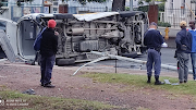 The taxi overturned after a collision with another taxi in Durban