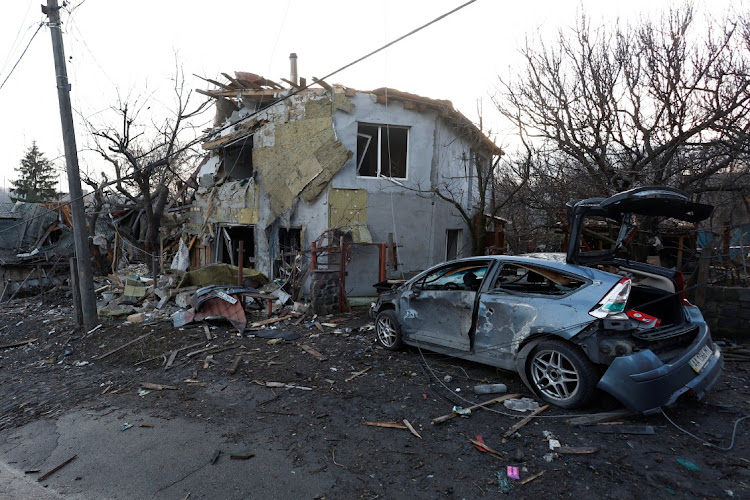 A house and car damaged during a Russian missile strike on Kyiv, Ukraine, on December 31 2022.