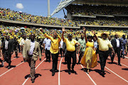 Premier of North West Supra Mahumapelo, President Jacob Zuma, Baleka Mbete and Cyril Ramaphosa greeting ANC's supporters at the Royal Bafokeng Stadium during the organization's 104th birthday celebrations. Photo Thulani Mbele.