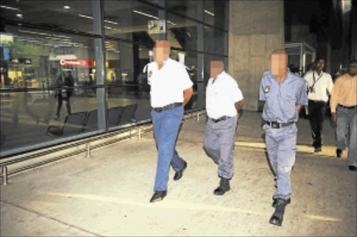 UNIFORMED SUSPECTS: Three policemen were arrested at the OR Tambo Airport where they are stationed after being investigated for a criminal activity. Photo: Tsheko Kabasia