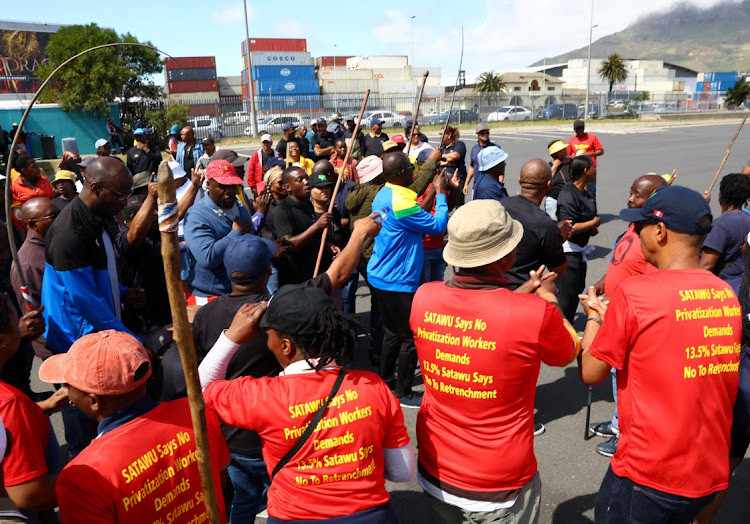 Workers at South Africa's state-owned logistics firm Transnet protest outside the Port of Cape Town as they continue their nationwide strike action that could paralyse ports and freight rail services in Cape Town, South Africa, October 14, 2022.