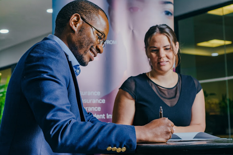 TrustGro CEO Tonderai Mutesva and mTek CEO Bente Krogmann sign the partnership initiative that secured Sh170 million funding for affordable health insurance