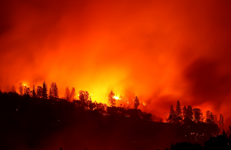 The Camp Fire burns in the hills near Oroville, California.