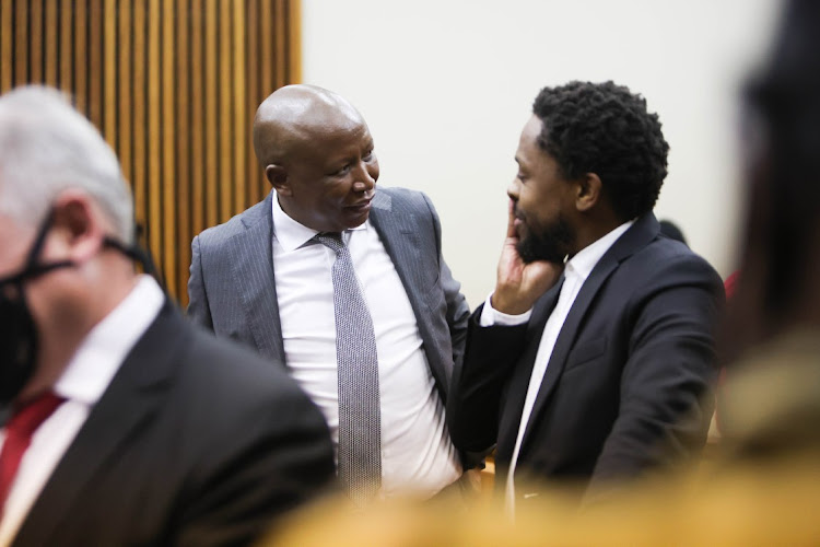 Julius Malema and Mbuyiseni Ndlozi after court proceedings on May 6 at the Randburg magistrate's court, Johannesburg.