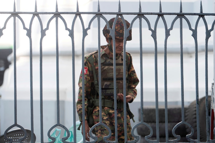 Myanmar soldiers look on as they stand inside Yangon City Hall after they occupied the building, in Yangon, Myanmar February 2, 2021.