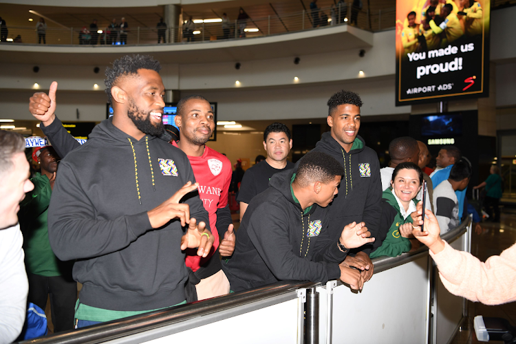 Springbok players with captain Siya Kolisi and fans during Banyana Banyana coach Desiree Ellis arrival press conference at OR Tambo International Airport on August 11, 2023.