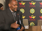 Hawks head Lt-Gen Godfrey Lebeya leaves the press briefing after tough questions from the media on Tuesday.  