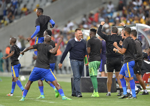 Cape Town City FC head coach Eric Tinkler (C) celebrates with his bench during the Absa Premiership match against Kaizer Chiefs at Cape Town Stadium on April 25, 2017 in Cape Town, South Africa.