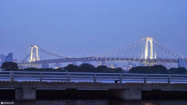 tokyo rainbow bridge by night in Odaiba, Japan 