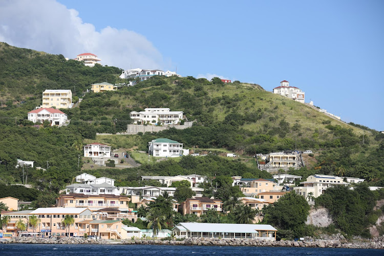 Houses line the coastline of St. Kitts. 