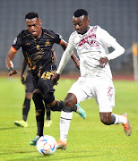 Tshediso Patjie of Swallows and Khulekani Shezi of Royal AM during the DStv Premiership match between Swallows FC and Royal AM.