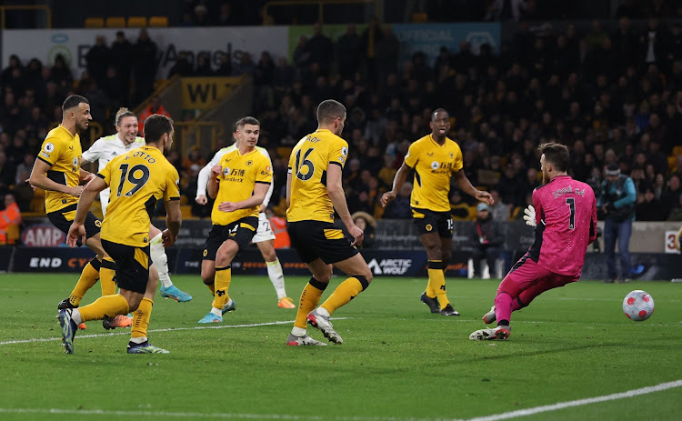 Leeds United's Luke Ayling (2nd R) scores past Wolves goalkeeper Jose Sa