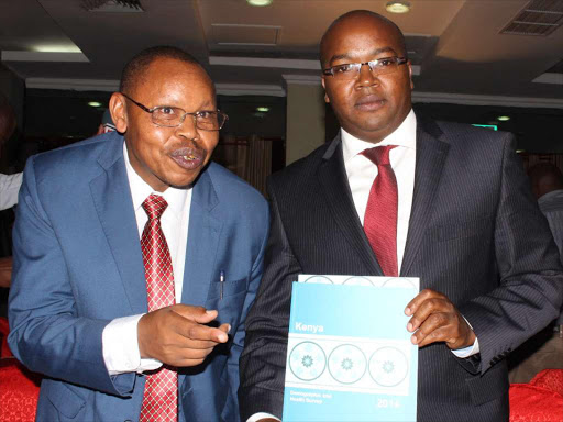 Devolution Principal Secretary Saitoti Torome (left ) and Health Principal Secretary Dr.Nicholas Muraguri at the KICC on Thursday,January 14 during the launch of the Kenya demographic and health survey. PHOTO/COLLINS KWEYU