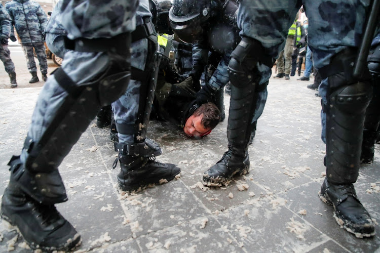 Riot police detain a man during a rally in support of jailed Russian opposition leader Alexei Navalny in Moscow, Russia, January 31 2021. Picture: REUTERS/MAXIM SHEMETOV