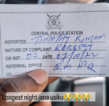 Njugush showing his police OB number