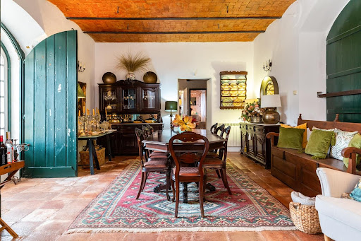 Rustic dining room with sideboard and table in this luxury house for sale in Arcos ($1,209,951 - 341 m²)