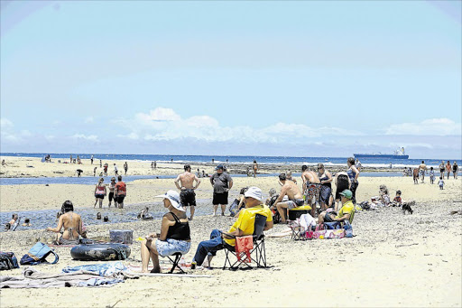 SUNNY SKIES: Beachgoers take advantage of the wonderful weather over the Christmas weekend in East London Picture: STEPHANIE LLOYD