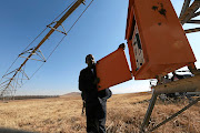 MK veteran Ronnie Matshaya with an irrigation pivot  that was bought without any electric cabling, rendering it little more than scrap metal. The farm is also without the three-phase electricity it needs to run equipment.