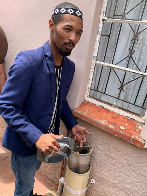 Joint Action Programme co-ordinator Hlwati Sigqibo explains how household grey water is filtered through a bag at the SalTuba Gap Tap project event on Friday