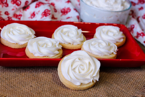 Sugar Cookie Frosting on a plate of cookies.