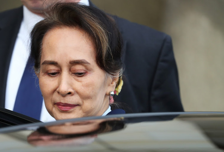 Myanmar's leader Aung San Suu Kyi leaves the International Court of Justice (ICJ) after the second day of hearings on December 11, 2019.