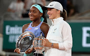 Finalist Coco Gauff of USA (left) and winner Iga Swiatek of Poland during the trophy ceremony of the women's French Open final at Roland Garros in Paris on June 4 2022.