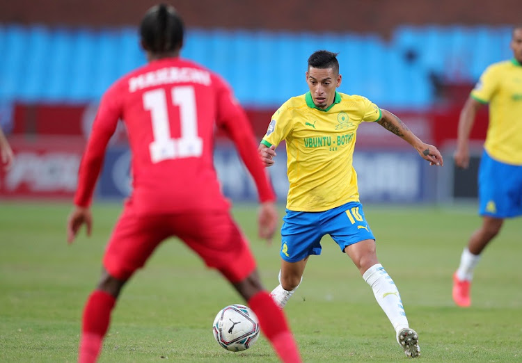 Gaston Sirino of Mamelodi Sundowns challenged by Kudawashe Mahachi of Supersport United during the DStv Premiership match between Mamelodi Sundowns and Supersport United at Loftus Versfeld on May 26, 2021 in Pretoria, South Africa.