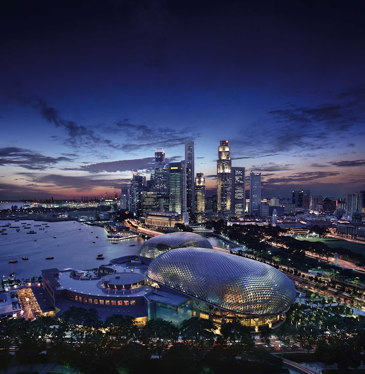 A beautiful view of the very modern Singapore skyline at dusk.