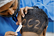 A hairdresser shaves-in 