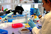 A researcher works inside a laboratory during the development of the Italian ReiThera Covid-19 vaccine, in this undated handout photo in Rome, Italy. 