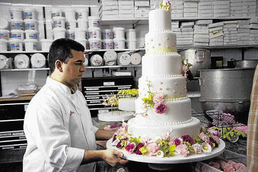 Buddy Valastro puts the finishing touches on one of his cakes Picture: REUTERS