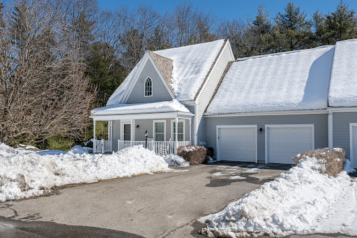Gray house with snow and double garage in this luxury apartment for rent in Yarmouth ($4,000)