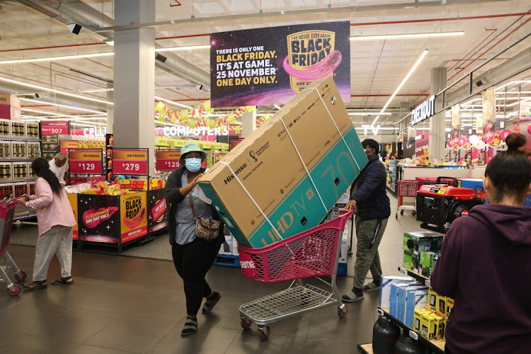 A couple buying a TV during a Black Friday spree at Game in Mall of Africa. The store opened its doors for business at midnight.