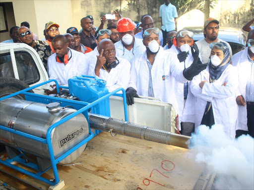 Mombasa governor Hassan Joho (Centre) accompanied by other county health staffs during the launch of fogging machines on January 8. /JOHN CHESOLI