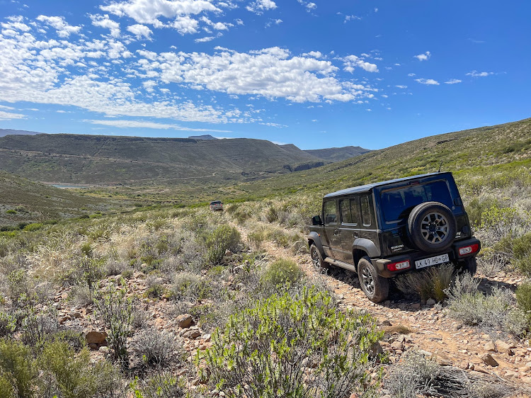 The author follows guide Pey down a section of jeep track leading away from Impangele Mountain Lodge.