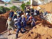 The construction worker is rescued from the rubble and sand after a landslide at Durban's Bluff on 24 April 2018.