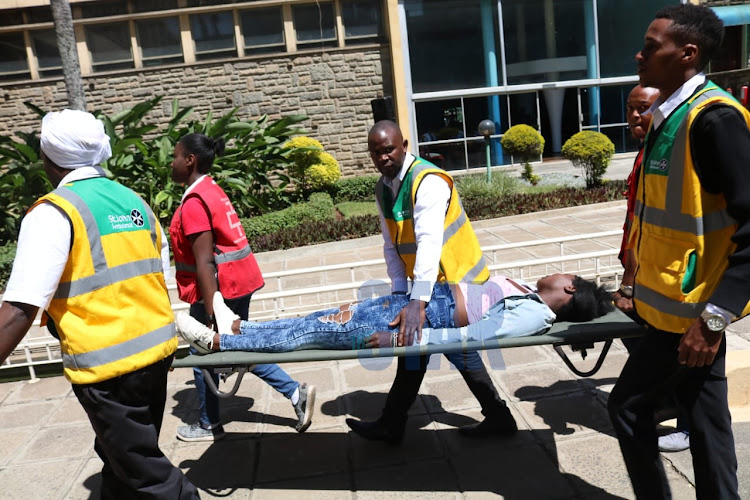 Another lady faints at Parliament Buildings during body viewing of late President Daniel arap Moi.