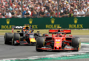 Chales Leclerc (front) and Max Verstappen had a robust duel at Silverstone on Sunday.