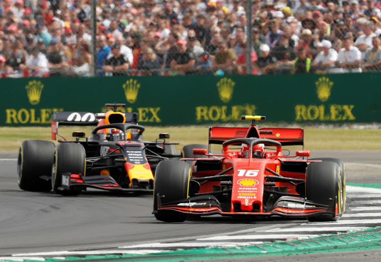 Chales Leclerc (front) and Max Verstappen had a robust duel at Silverstone on Sunday.