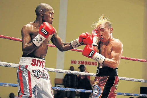 LEFT ON CUE: Siyabonga Siyo, in an earlier fight against Lito Dante from the Philippines during a WBA mini-flyweight International title fight at the Orient Theatre, fights Hekkie Budler in a highly-anticipated mini-flyweight clash at Emperors Palace on Saturday Picture: ALAN EASON