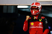 Pole position qualifier Charles Leclerc celebrates in parc ferme during qualifying ahead of the F1 Grand Prix of Bahrain at the Bahrain International Circuit on March 19 2022.