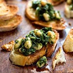 Tuscan Kale & White Bean Bruschetta was pinched from <a href="http://www.eatingwell.com/recipes/tuscan_kale_white_bean_bruschetta.html" target="_blank">www.eatingwell.com.</a>